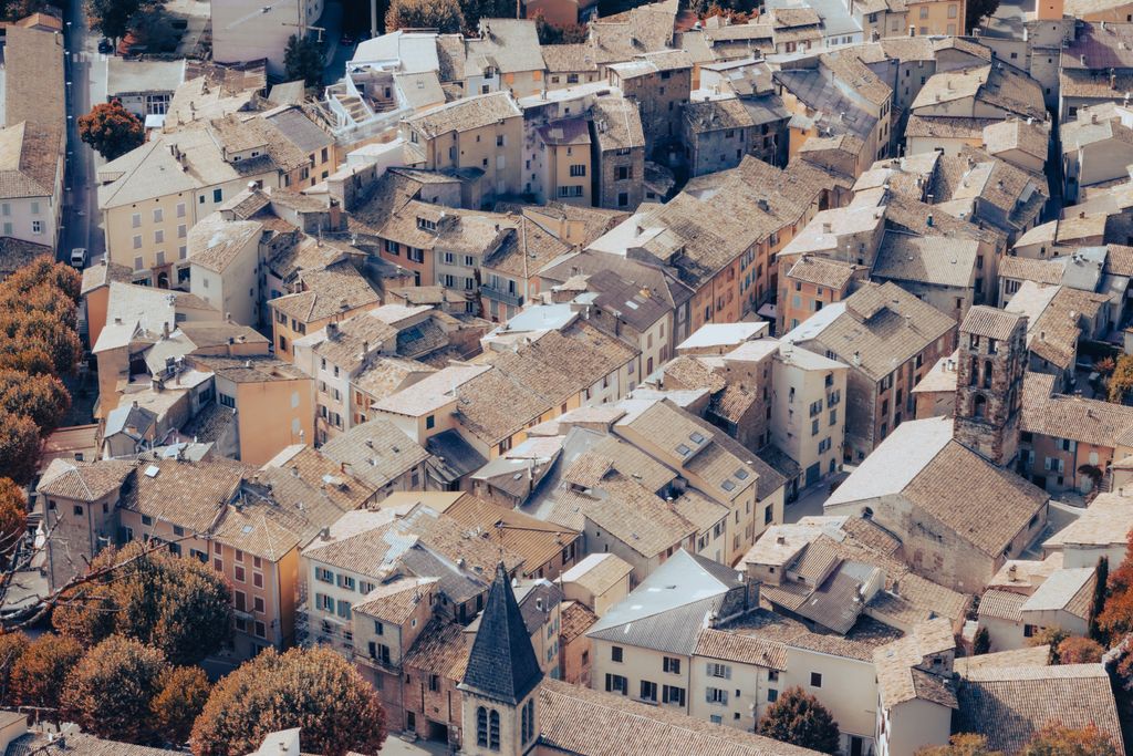 Capture the quaint architecture of Castellane, a picturesque village in Provence, France.